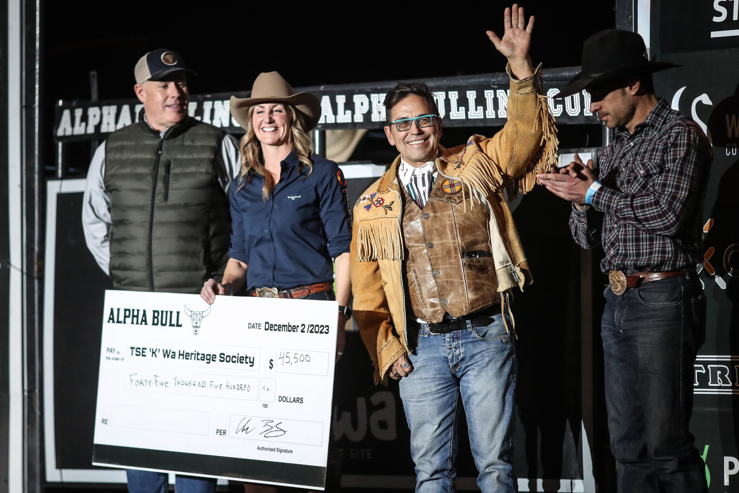 Garry Oker receives cheque on behalf of Tse'k'wa